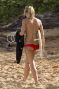 Surfing girl in red bikini