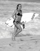 Hot surfer girl in black bikini