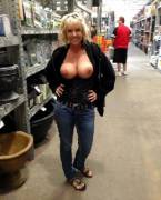 Blonde with her tits out at the store.