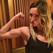 Katie.. She's got bigger biceps than John Diggle