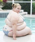 Gotta love seeing al that blubber in a bikini, poolside