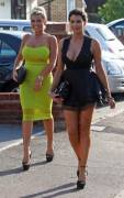 Two gorgeous women dressed provocatively for a night out.