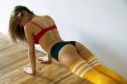 Push-ups in her yellow thigh high socks