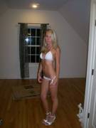 Blonde in white bikini is doing some packing