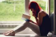 Redhead reading in leggings