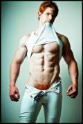Fiery football player peeling off his practice gear.