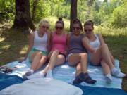 4 girls in a park showing socks