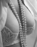 Cleavage and pearls.