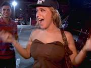 Busty girl flashing in a parking lot