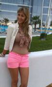 tan ruffled shirt and pink shorts