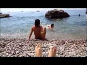 Naked girl dance on nude beach.