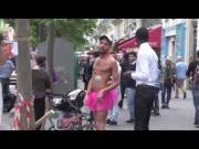 Two topless women at the 2014 gaypride parade in Paris.